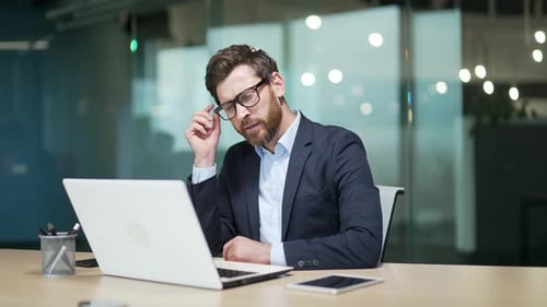 Bored business man in office Sleeping sleepy yawning boredom at workplace indoors Tired Exhausted