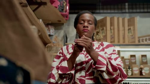 Female Customer Testing Scent in Store