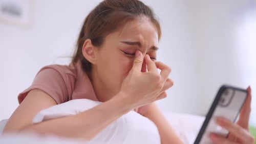 Young Woman Lying Down Feeling Sad