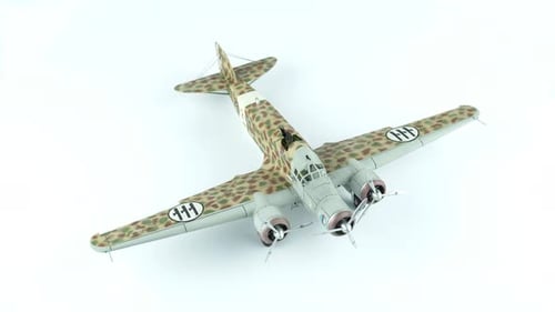 Vintage Camouflage Airplane Model on Display