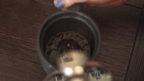 Making Coffee in a Gray Coffee Pot