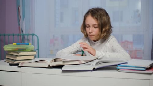 Child Doing Homework at Desk