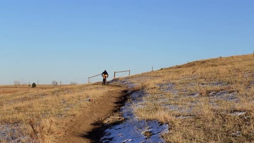 Mountain bikers riding in a rural trail