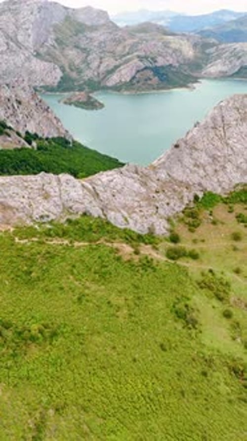 Grey bare rocks surrounding the beautiful lake. Nature of national park in Leon, Spain, Europe.