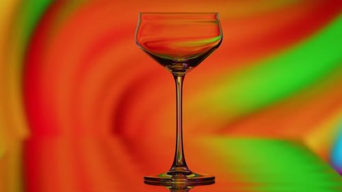 The Clear Glass is Standing Infront of a Colorful Curvy Rainbow Background