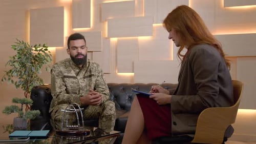 Man Talking with Therapist in Office Setting