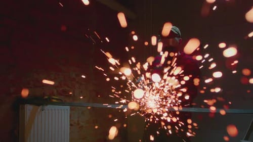 Welder at Work in Industry Cutting Slow Motion Lots of Sparks in Factory Man Cuts Metal with Angle