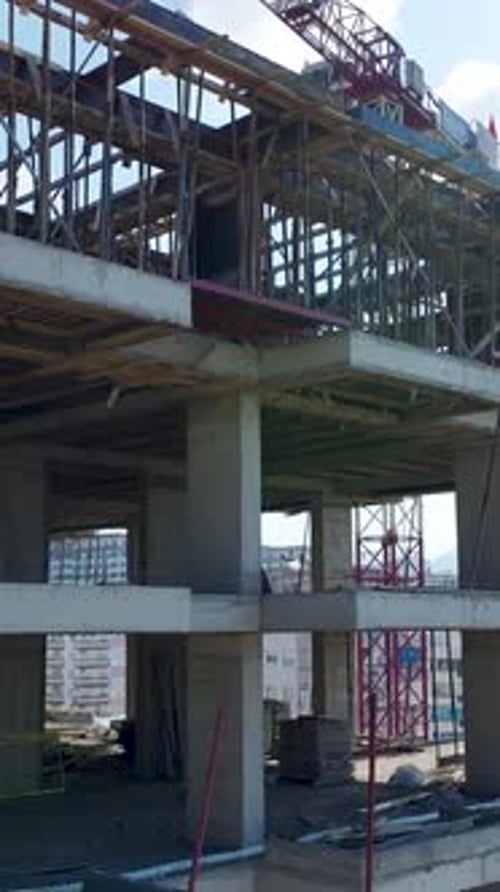 Vertical Drone View Building Frame Under Construction with Repetitive Structural Patterns