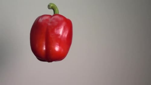 Rotating Red Bell Pepper Against Neutral Background