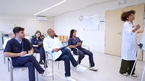 Doctor Presents Medical Training to Students in Hospital Classroom
