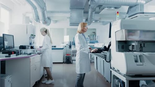 Scientists Working in a Modern, Brightly Lit Laboratory