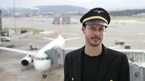 Pilot at Airport with Airplane Behind