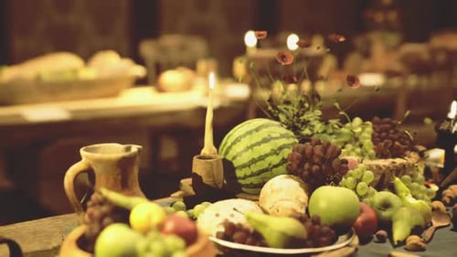 Rustic Harvest Table with Fresh Fruits and Candlelight
