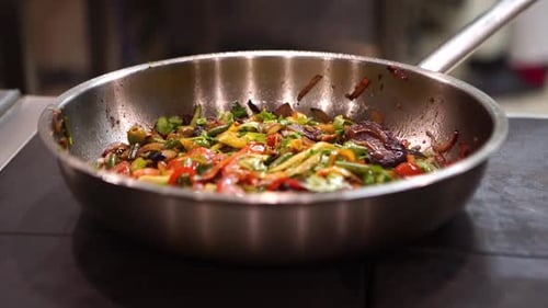 Vegetables Cooking in Frying Pan on Stovetop