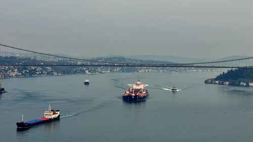 Drone View of a Cargo Ship Passing Under the Bridge in the Istanbul BosphorDji 20240316094441 0011 D