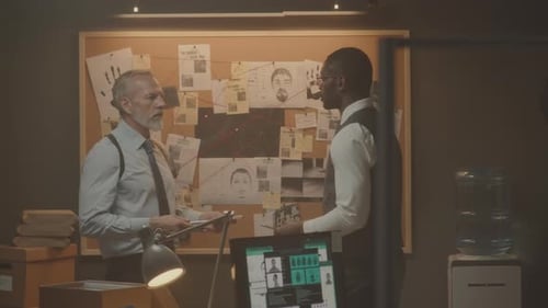 Police Detectives Investigating Case in Dark Office