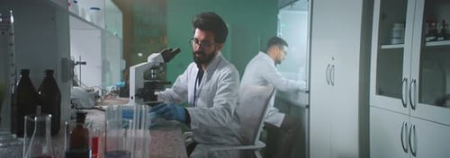 Scientists Working in Modern Laboratory
