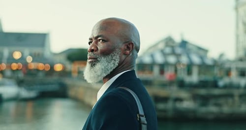 Serious, thinking and African businessman in the city with leadership, corporate career