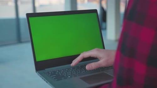 Close Up Hands Engineer Using Laptop Computer with Green Screen Shows Thumb Up Inside Building