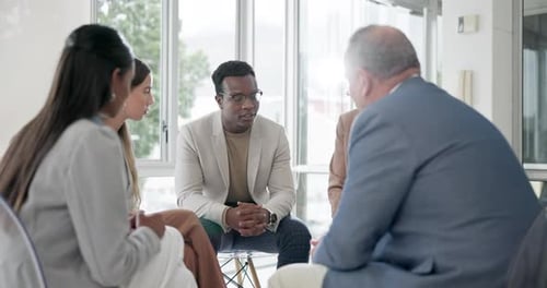 Diverse Team Meeting in Bright Modern Office