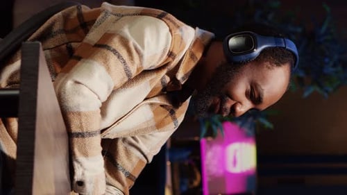 Vertical Video Man Hosting Podcast Using Professional Audio Equipment to Ensure High Sound Quality