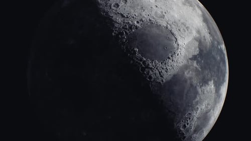 Realistic Rotating Moon Close-Up on Dark Space Background