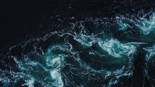 Drone Video with Birdseye View of the Abstract and Powerful Water Currents Rapids and Whirlpools of