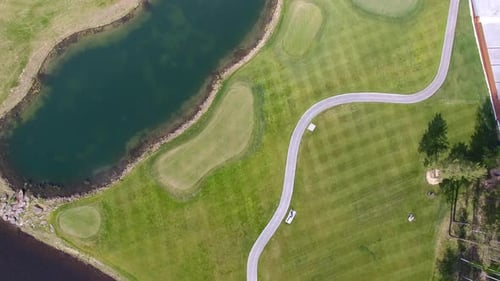 An Aerial View Shows a Beautiful Golf Course with Tranquil Lakes and Scenic Ponds