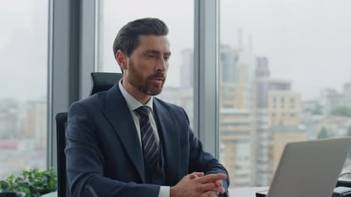 Ceo Conducting Video Meeting with Partners in Office Using Laptop Close Up