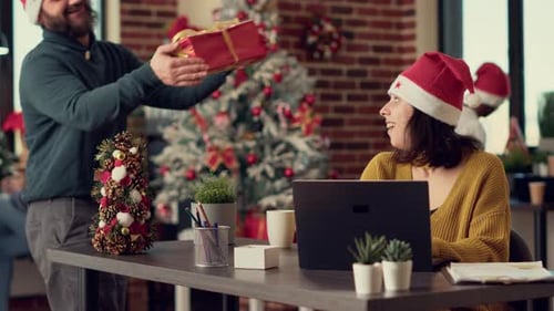 Office Workers Celebrating Christmas Eve with Gifts