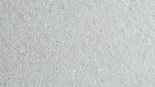 white foam and soap bubbles. Slide shot, close-up