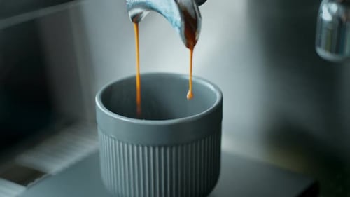 Espresso Pouring into a Gray Cup