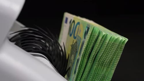 Euro Money Stack Being Processed in Counting Machine