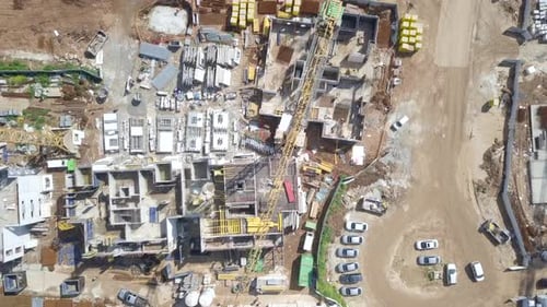 Large residential construction site with cranes, Aerial view