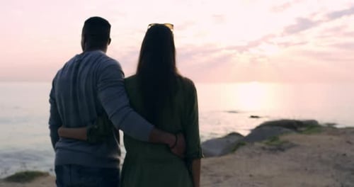 4k video footage of a young couple enjoying some quality time at the beach