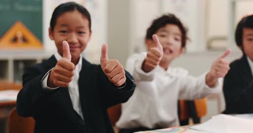 Enthusiastic Children Giving Thumbs Up in Classroom