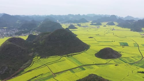 Aerial view of fields and mountains, China.
