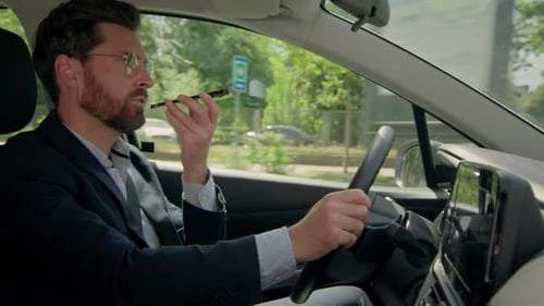 Man in Car Talking on Phone
