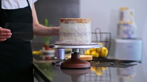 Focused Confectioner Showing Process Wrapping Stretch Cover Homemade Cake