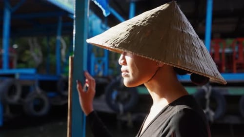 Woman in Conical Hat Gazing Off