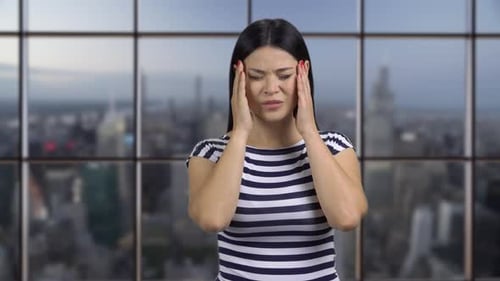 Asian Woman Rubbing Massaging Head From Headache