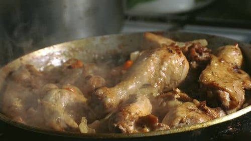 Chicken Pieces Sizzle in a Pan