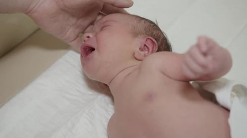 Close Up of Soothed Crying Infant