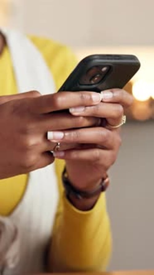 Woman Using Mobile Phone in Kitchen Indoors
