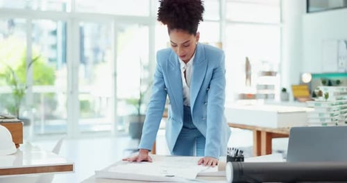 Blueprint, engineering and business woman planning project in modern office on construction site