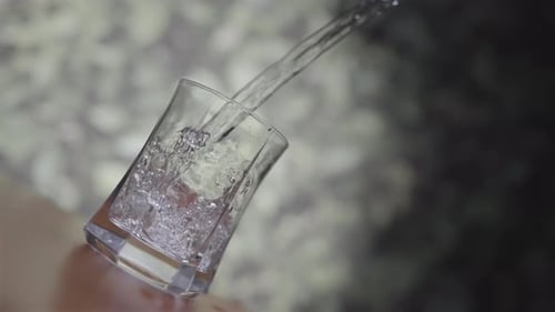Water Pouring Into Elegant Crystal Glass
