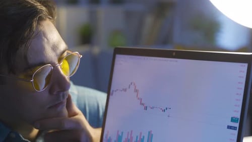 A trader analyzing the chart of a stock market chart.