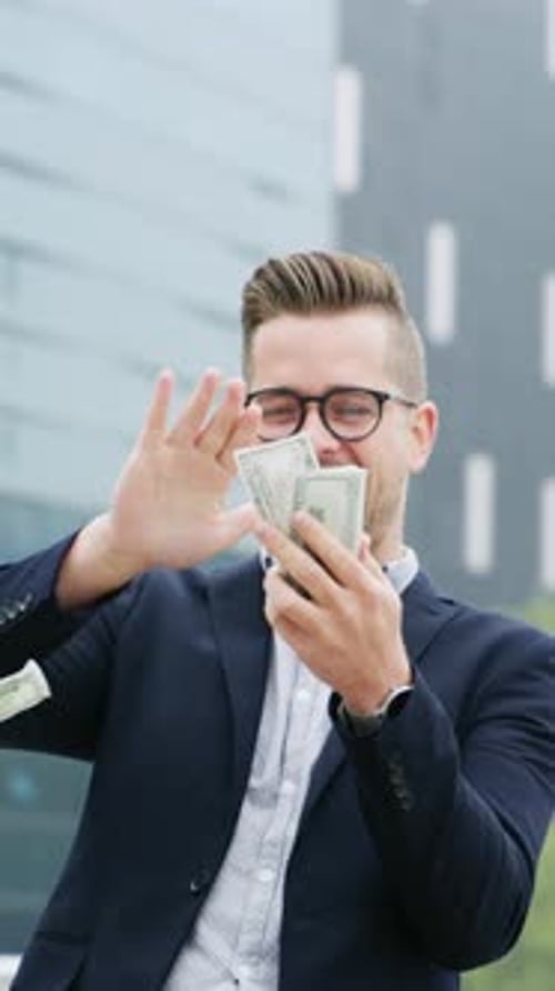 Happy, business man or money rain in city for investment return, trade earnings