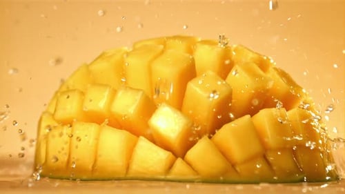 Raindrops Fall on Fresh Mango Filmed on a Highspeed Camera at 1000 Fps