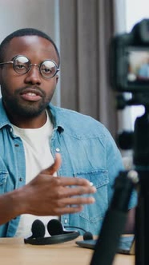 Man in Denim Shirt Records Video Blog at Home